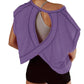 Purple open-back workout top with stylish cutouts and black shorts for active fashion