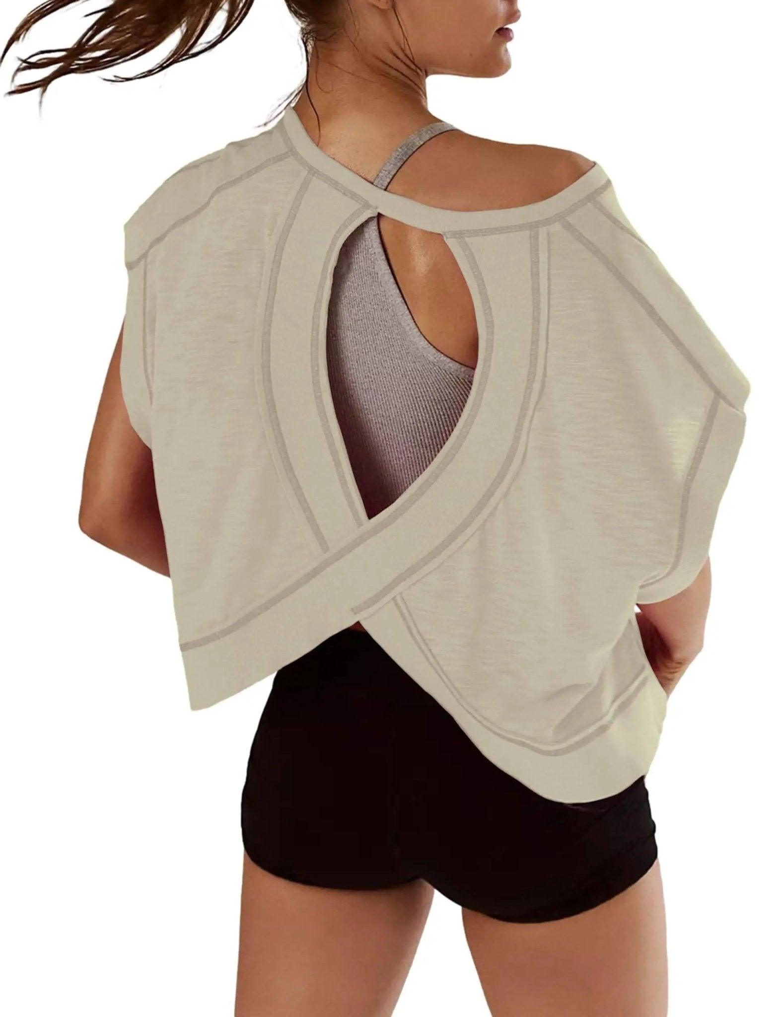 Stylish off-shoulder women's top with cutout back design, paired with black shorts for casual fashion