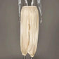 Cream metallic balloon pants on mannequin, women's fashion