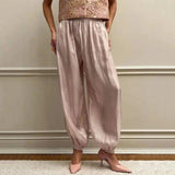 Black lace trim on satin pants with pink heels, women's fashion