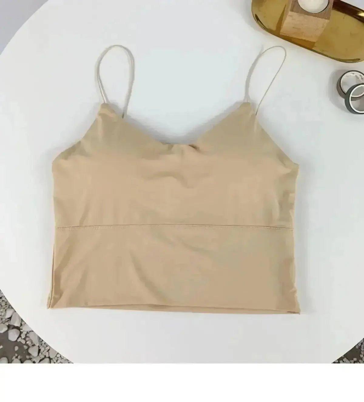 Beige women's crop top with thin straps, stylish and versatile fashion piece