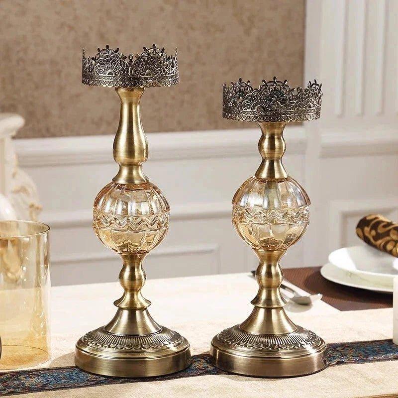 Elegant brass candle holders with crystal bases and ornate crowns, perfect for luxury home decor