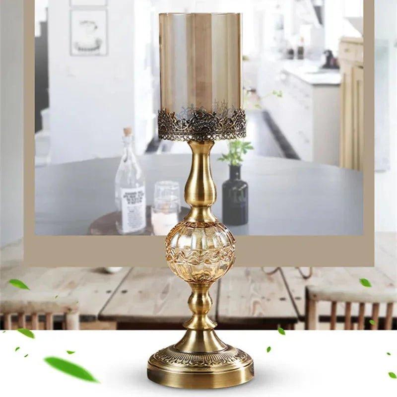 Elegant gold candle holder with ornate base and lace trim, perfect for home decor and table settings