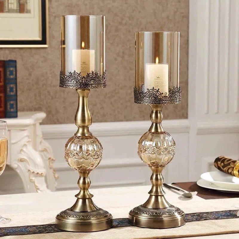 Elegant gold candle holders with glass shades and ornate bases for home decor