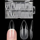Clear stiletto false nails in organized case, perfect for women's fashion and beauty
