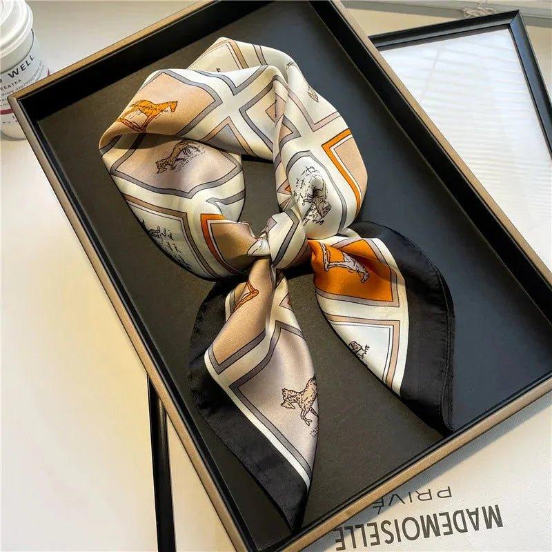 Elegant women's silk scarf with horse print, styled in gift box for fashion accessories