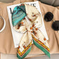 Elegant women's silk scarf with horse print, styled on beige coat with sunglasses and magazine