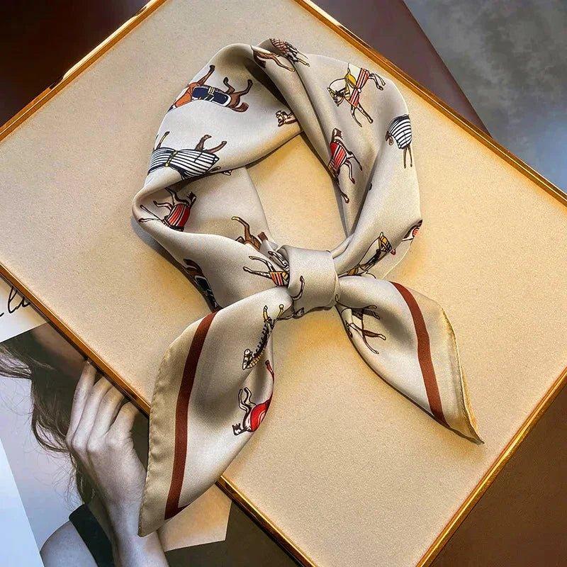 Elegant women's silk scarf with horse print, styled as neck tie on gift box, fashion accessory