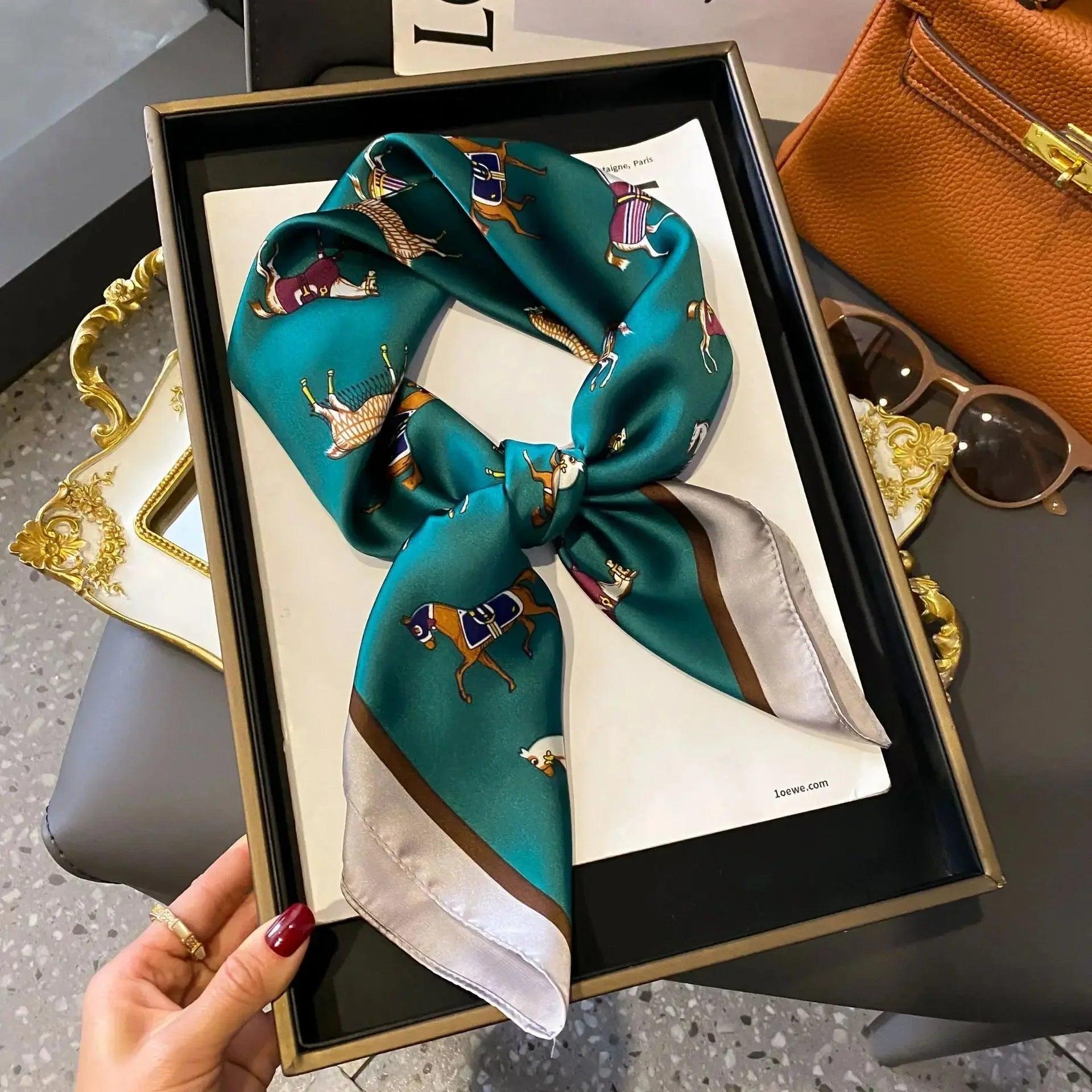 Luxury teal silk scarf with horse print, styled in gift box for women's fashion accessories