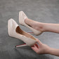 Beige women's high heels with pointed toe and red sole, perfect for fashion and elegance