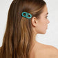 Turquoise patterned hair clip styling long brown hair, women's fashion accessory