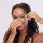 Woman styling curly hair with turquoise hair clips, fashion accessories for everyday beauty
