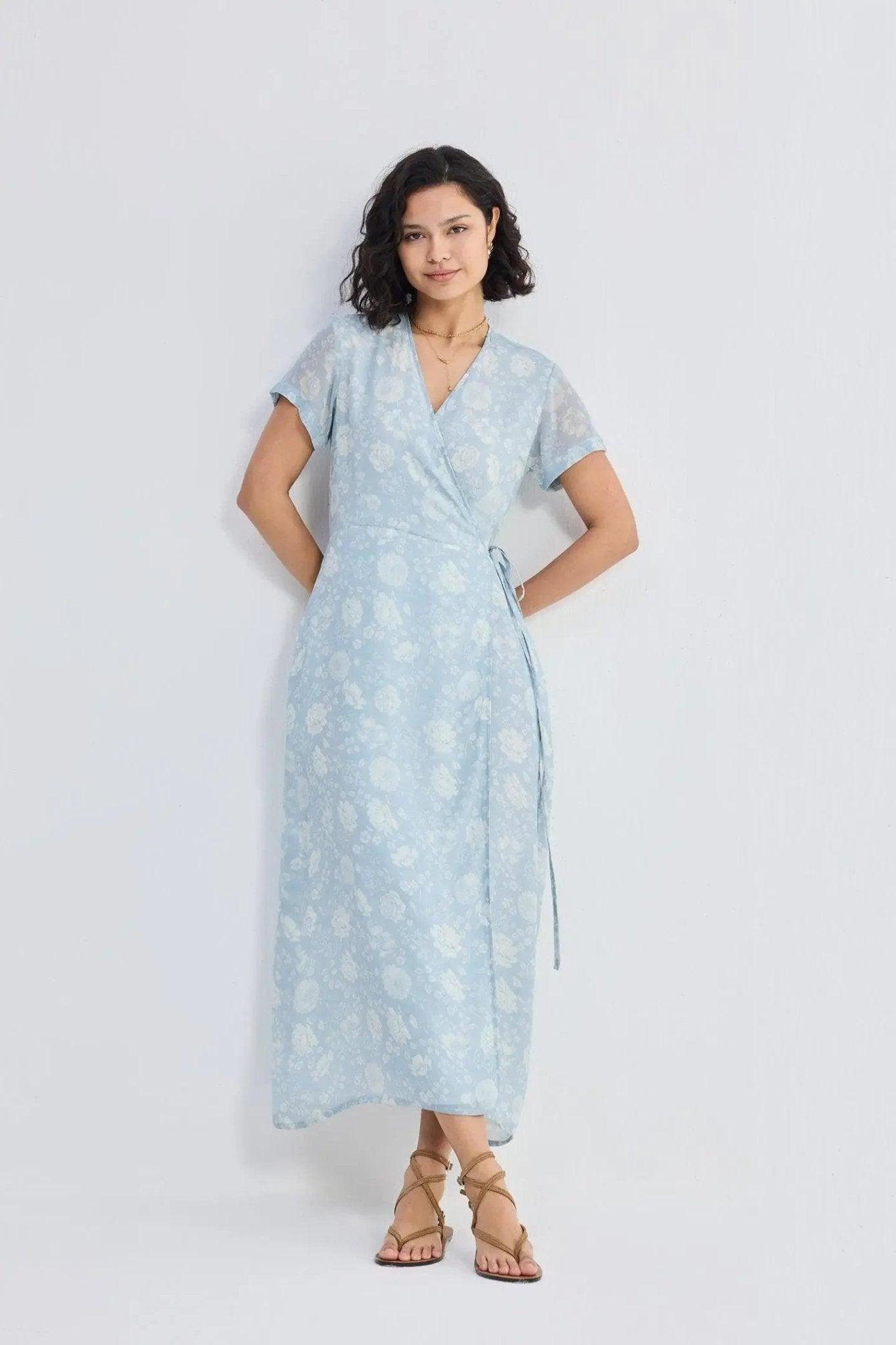 Light blue floral wrap dress with short sleeves, perfect for women's fashion and summer style.