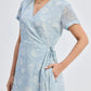 Light blue floral wrap dress with short sleeves and V-neck, perfect for women's fashion