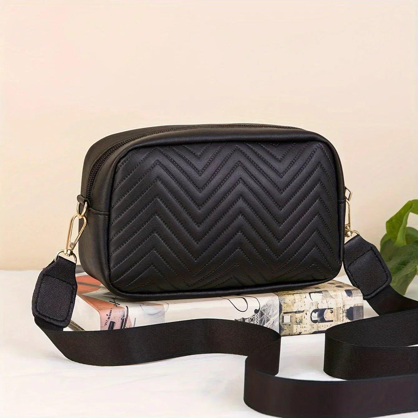Black quilted chevron crossbody bag with adjustable strap, stylish women's fashion accessory