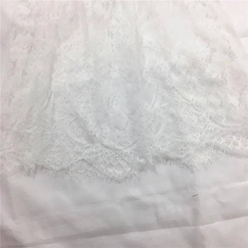 White lace fabric with floral pattern, delicate trim for women's fashion garments
