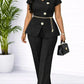 Black women's peplum suit with floral buttons, gold chain belt, and matching pants for elegant office fashion