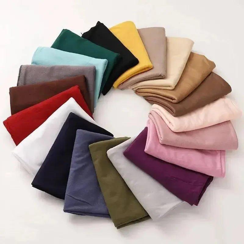 Assorted colorful women's fashion scarves arranged in a circle
