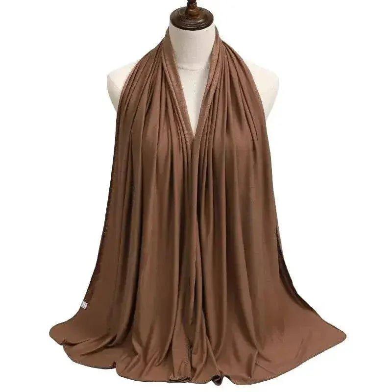 Elegant brown fashion scarf draped on mannequin, soft lightweight accessory for women's style
