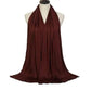 Elegant burgundy scarf draped on mannequin, perfect for women's fashion and beauty
