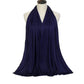 Navy blue women's halter neck dress with flowing fabric, elegant fashion style