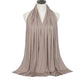 Elegant beige scarf draped on mannequin, perfect for women's fashion and beauty looks