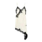 Elegant white lace-trimmed slip dress with asymmetrical hem, perfect for women's fashion