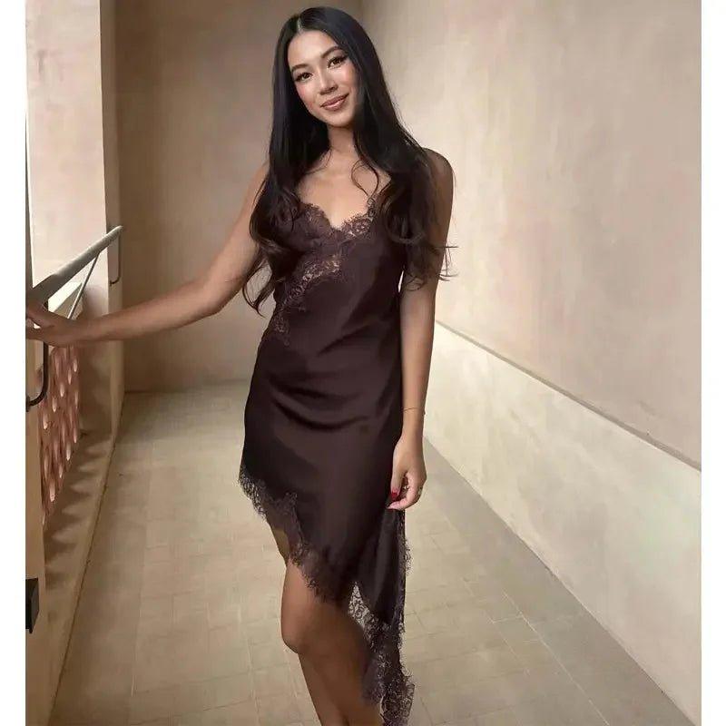 Woman in elegant brown lace-trimmed satin slip dress, perfect for loungewear or nightwear fashion.
