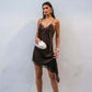 Woman in elegant brown lace slip dress with white clutch, fashion style