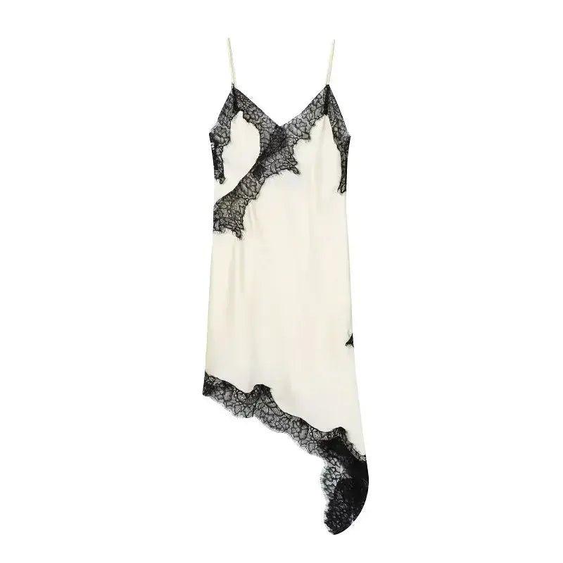 Elegant white lace-trimmed slip dress with black floral detailing, perfect for women's fashion