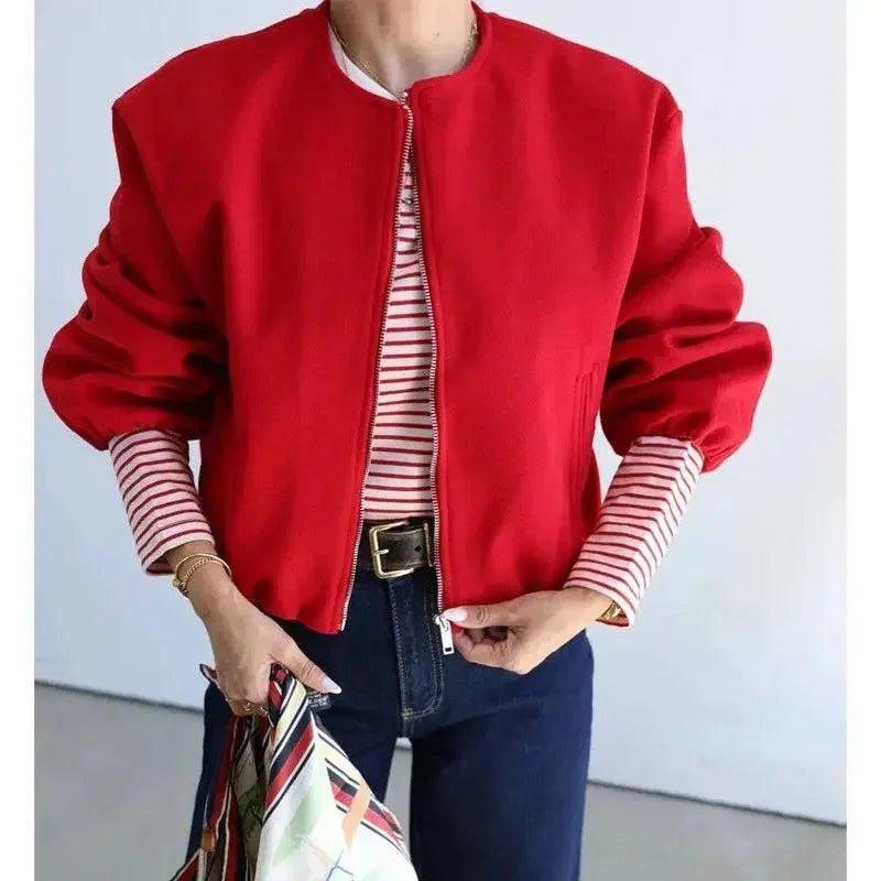 Red bomber jacket with striped sleeves, paired with jeans and belt for women's fashion