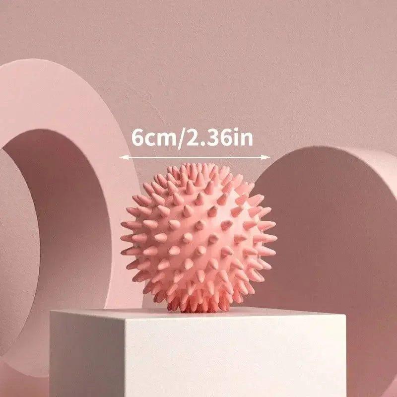 Pink spiky massage ball, 6cm, for muscle relief and self-massage therapy
