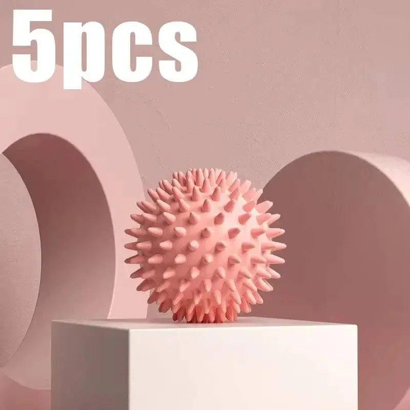 Pink spiky massage ball for muscle relief, 5pcs set on white pedestal