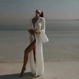 Woman in white beach cover-up at ocean shore, stylish summer fashion
