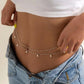Delicate pearl belly chain for women, layered waist accessory with gold chain, perfect for fashion outfits