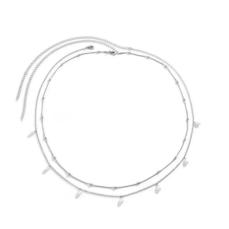 Layered silver choker necklace with delicate charms, perfect for women's fashion and everyday elegance.