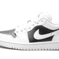 White and black Nike Air Jordan 1 low sneaker with classic design and perforated toe