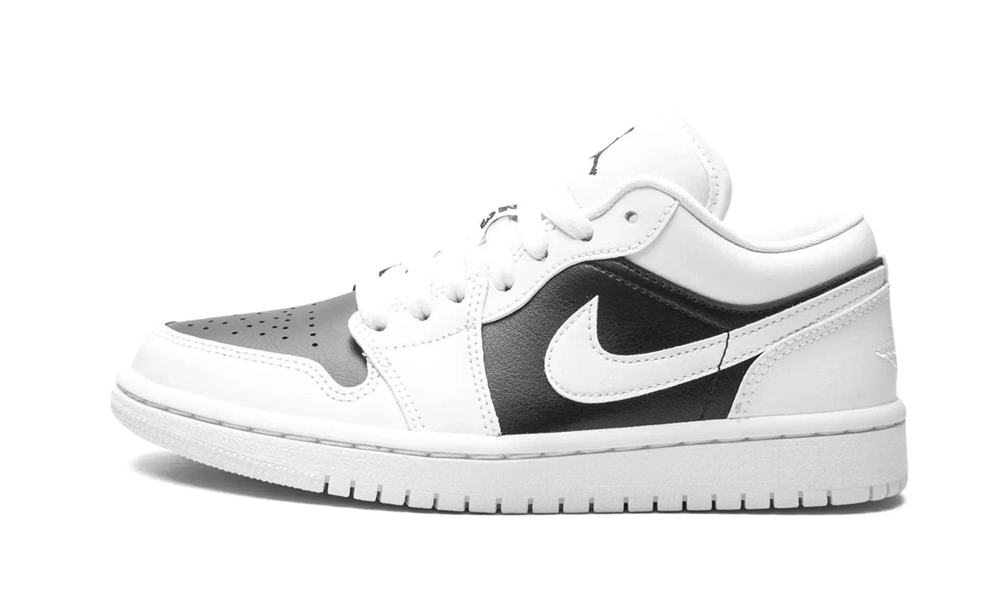 White and black Nike Air Jordan 1 low sneaker with classic design and perforated toe