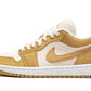 Women's tan and white low-top sneaker with corduroy texture and Nike swoosh