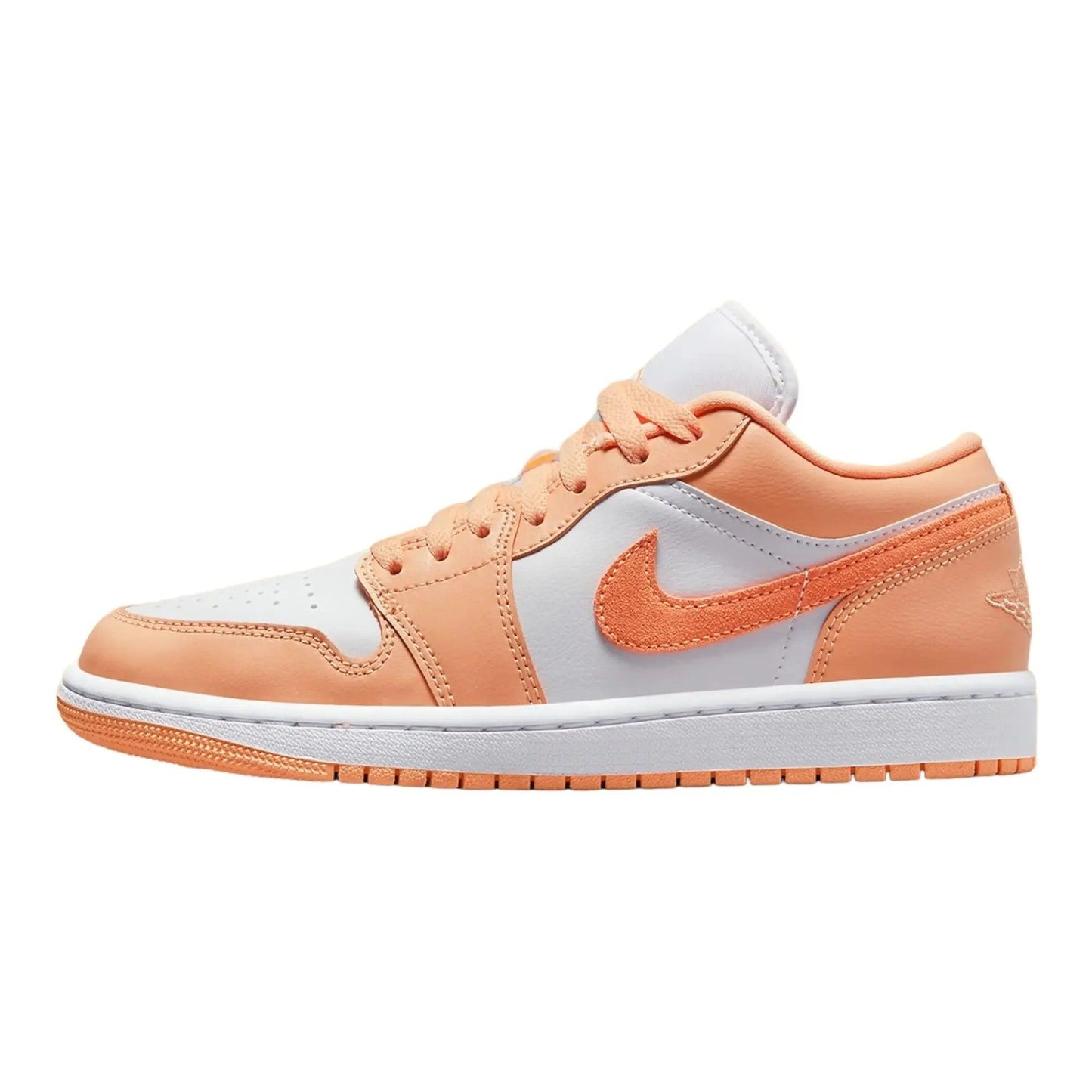 Women's peach and white low-top sneaker with Nike swoosh, stylish fashion footwear