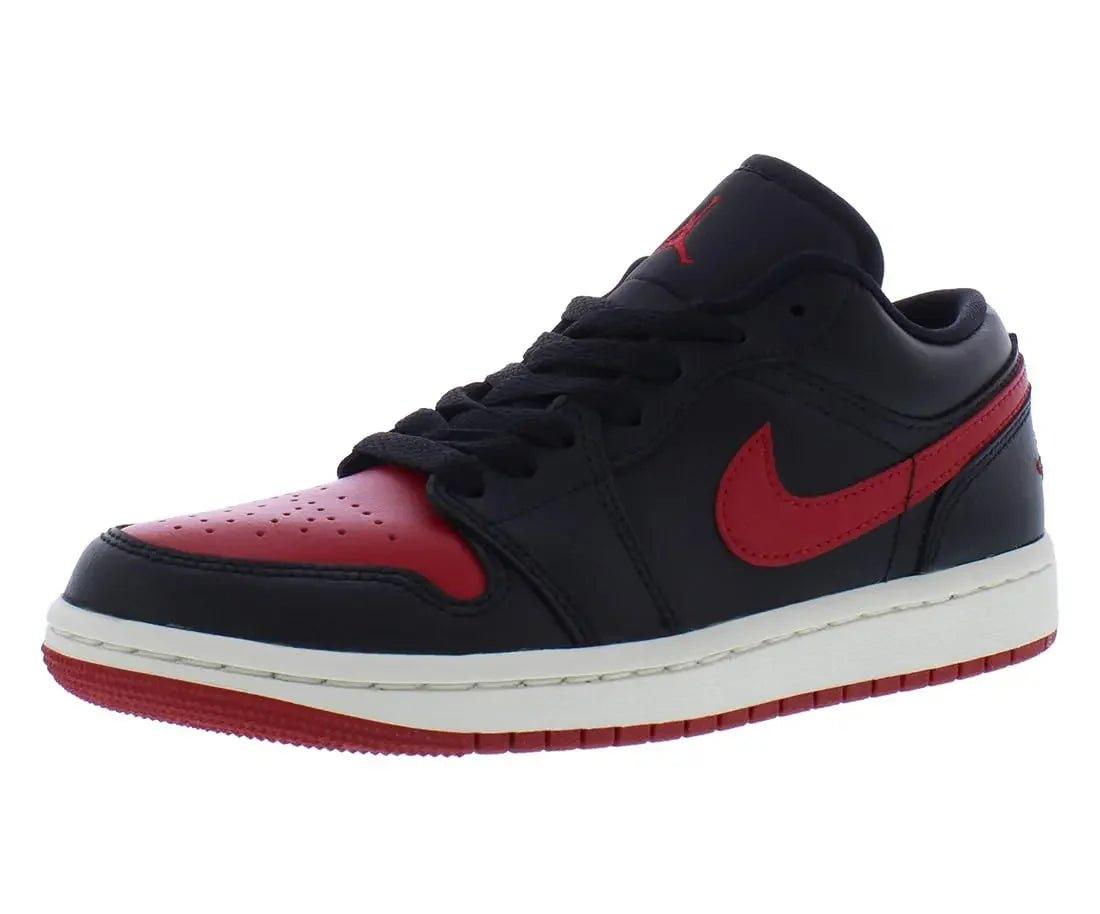 Black and red women's low-top sneaker with Nike swoosh, white sole, and perforated toe