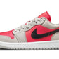 Women's pink and gray low-top sneaker with black swoosh, casual fashion footwear