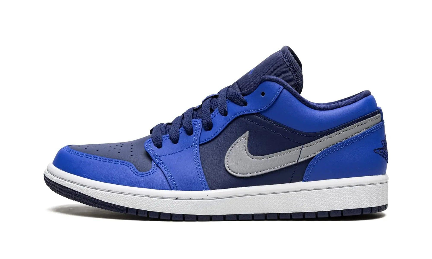 Blue and navy Nike Air Jordan 1 low sneaker with gray swoosh, white sole, fashion footwear