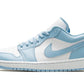 Light blue and white women's fashion sneaker with Nike swoosh, stylish low-top design for casual wear