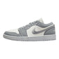 Gray and white low-top sneaker with Nike swoosh, casual fashion footwear for women