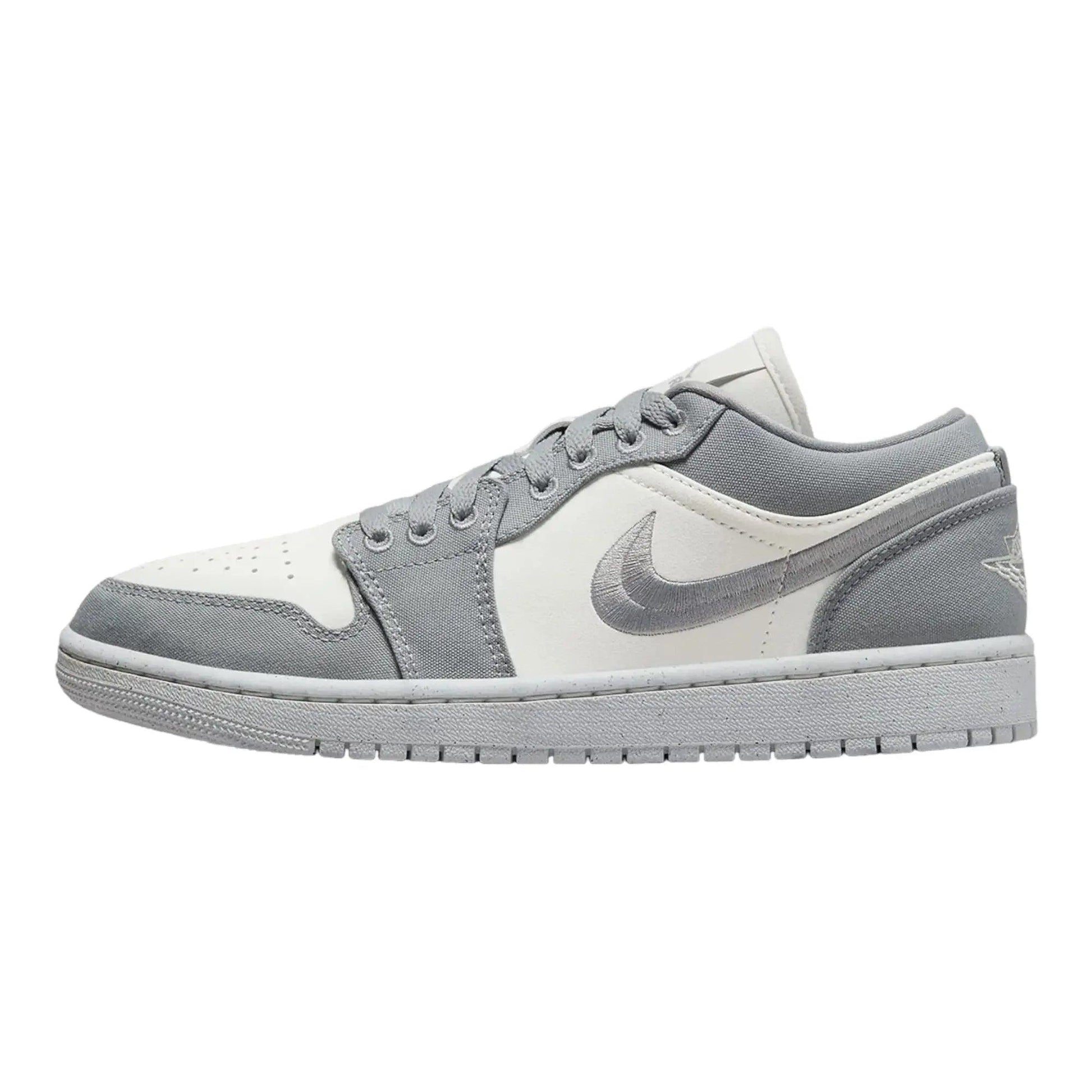 Gray and white low-top sneaker with Nike swoosh, casual fashion footwear for women