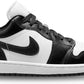 Black and white Nike Air Jordan 1 low sneaker with iconic swoosh and wing logo, stylish women's fashion footwear