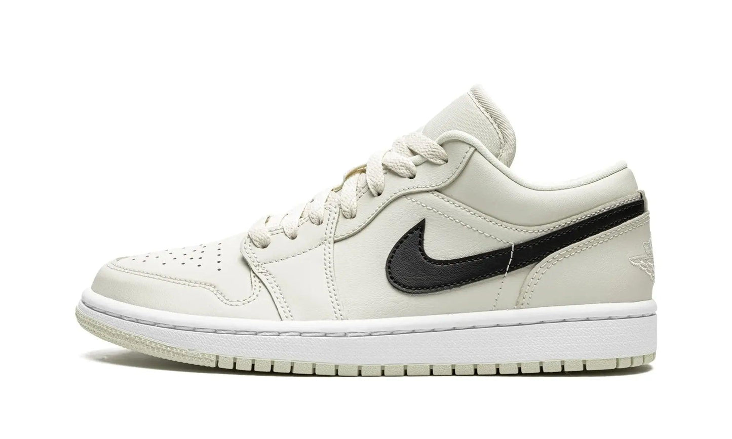 Cream white low-top sneaker with black swoosh, women's fashion footwear