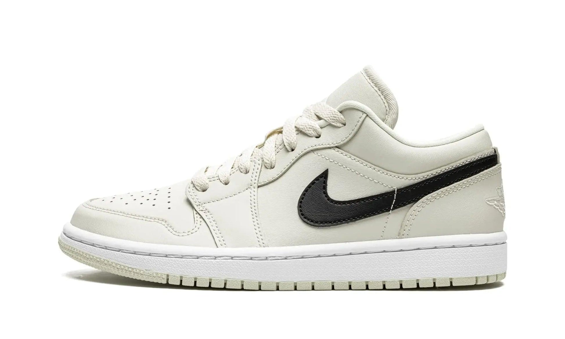 Cream white low-top sneaker with black swoosh, women's fashion footwear