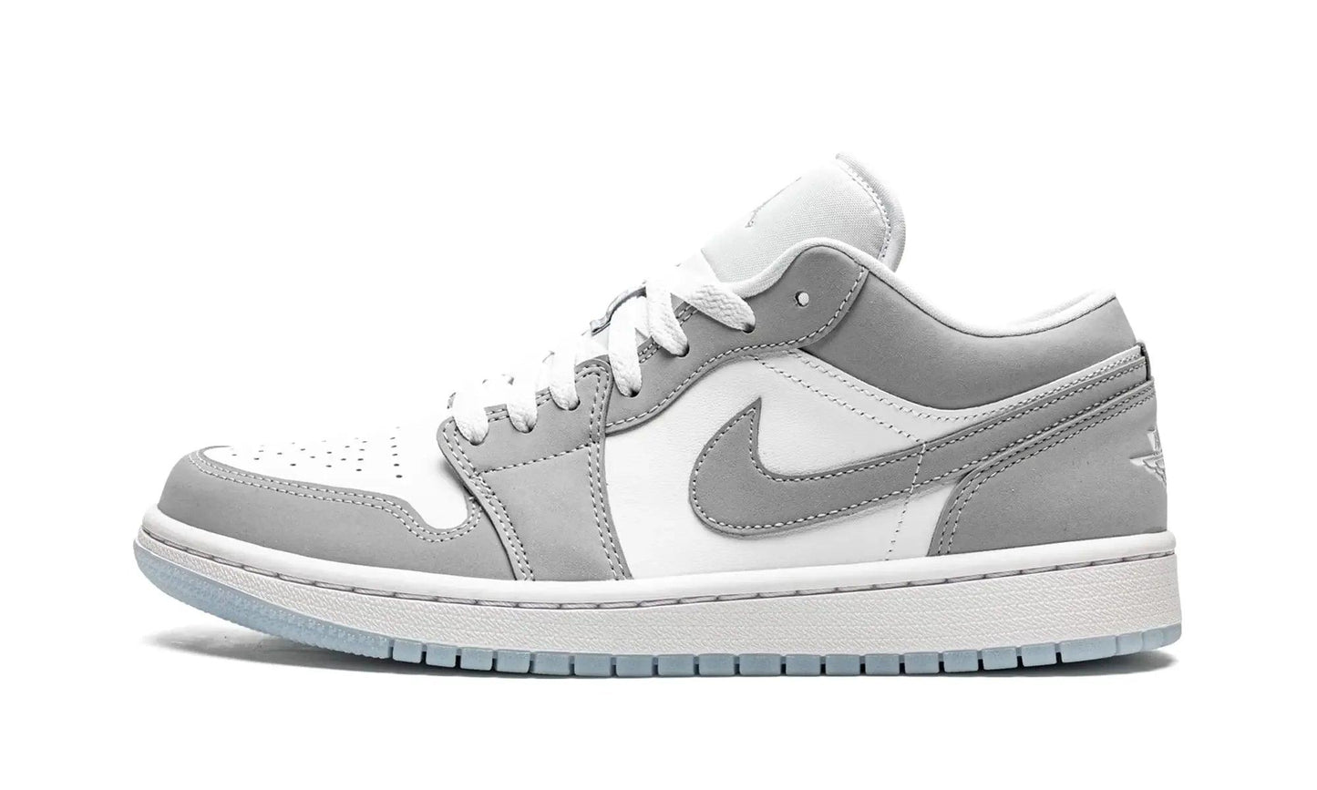 White and gray Nike Air Jordan 1 low-top sneaker with classic design and clean finish